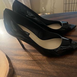 Nine West black patent leather peep toe pump size 10.5 never worn. Too big